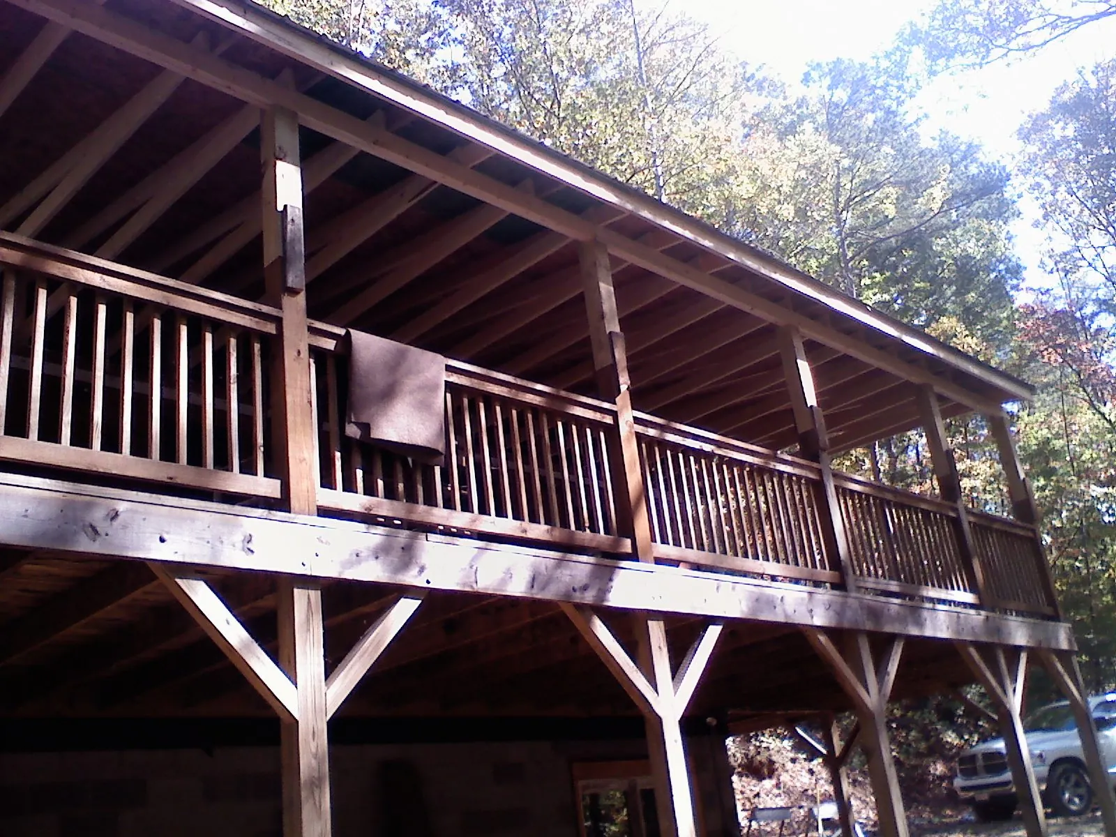 Timber framing under a new elevated porch and deck — Roof Leak Repair in Menno by Roofing Brothers